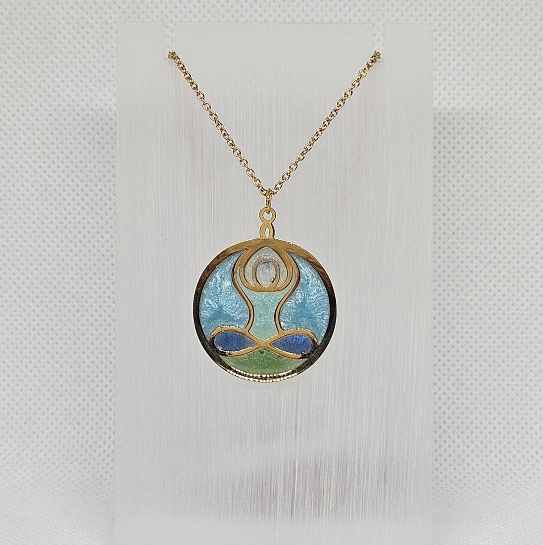 Pendentif en métal et résine